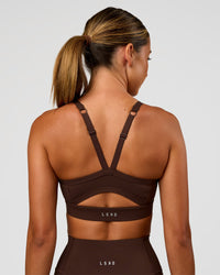 Woman wearing Momentum Sports Bra - Hot Chocolate | Model:Charli | Size:XS | Thumbnail Index: 4