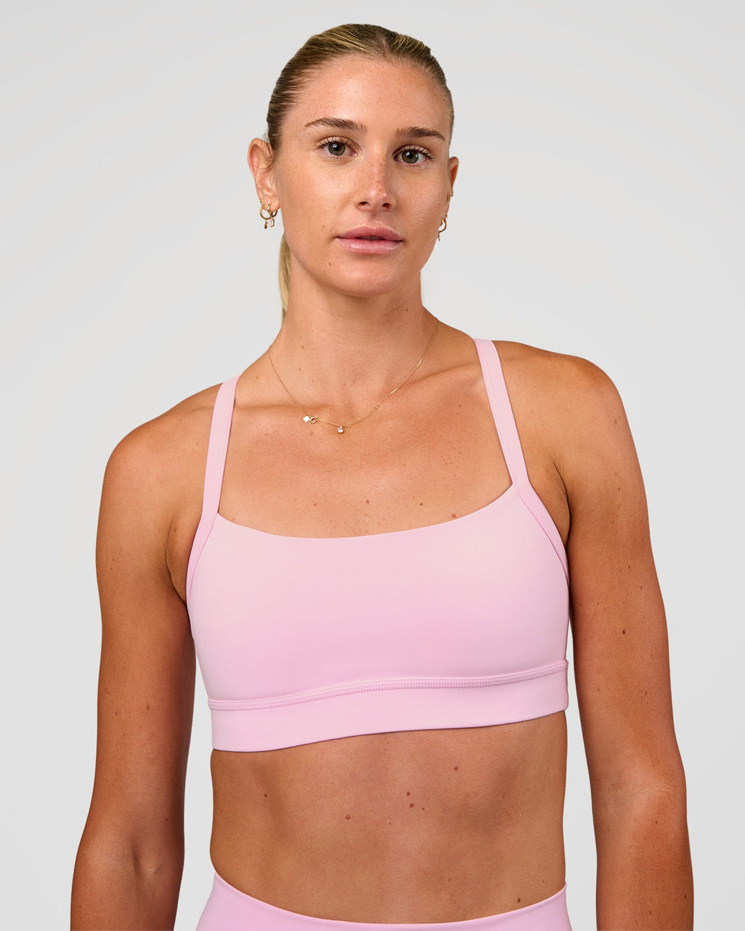 Woman wearing Momentum Sports Bra - Marshmallow | Model:Emelia | Size:XS