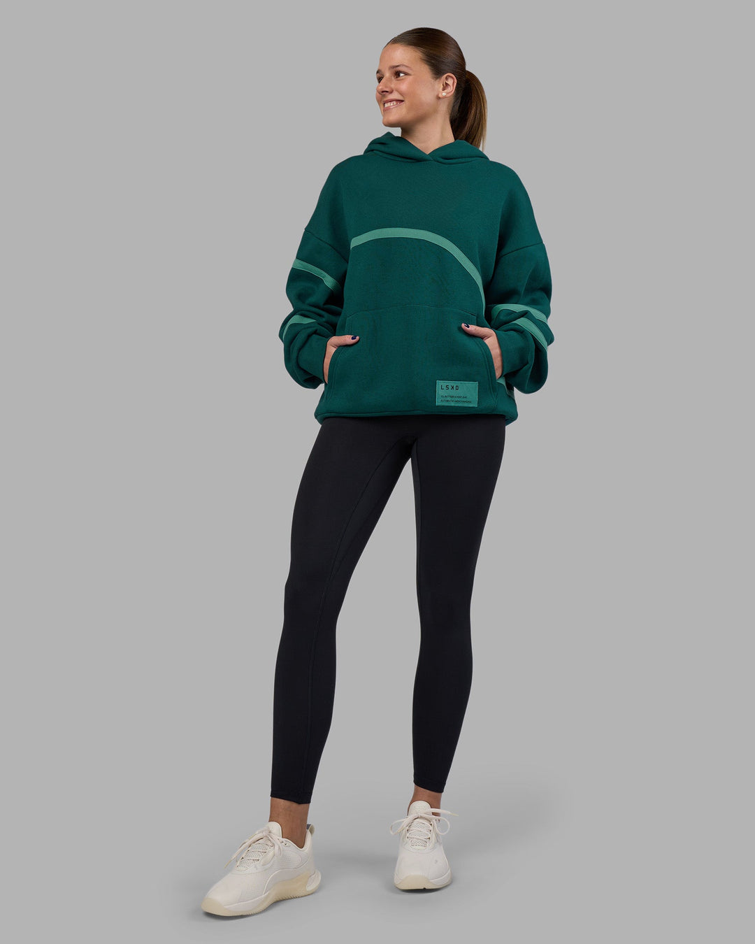 Woman wearing Movement Oversized Hoodie - Dark Moss-Agate Green | Model:Phoebe | Size:XS