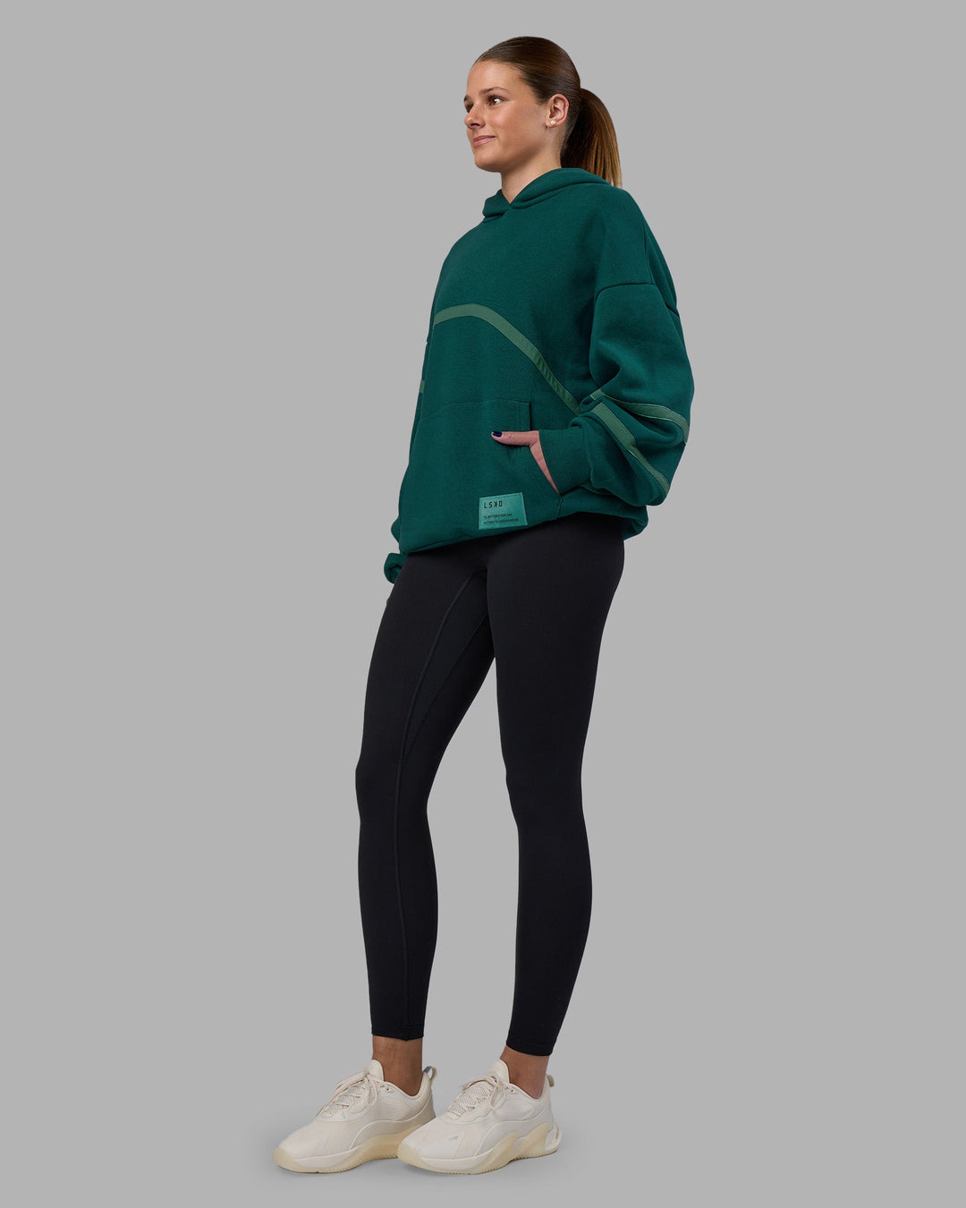 Woman wearing Movement Oversized Hoodie - Dark Moss-Agate Green | Model:Phoebe | Size:XS