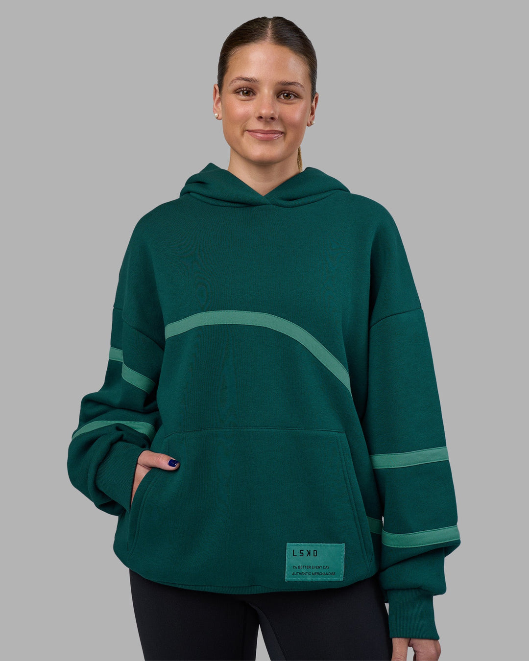 Woman wearing Movement Oversized Hoodie - Dark Moss-Agate Green | Model:Phoebe | Size:XS