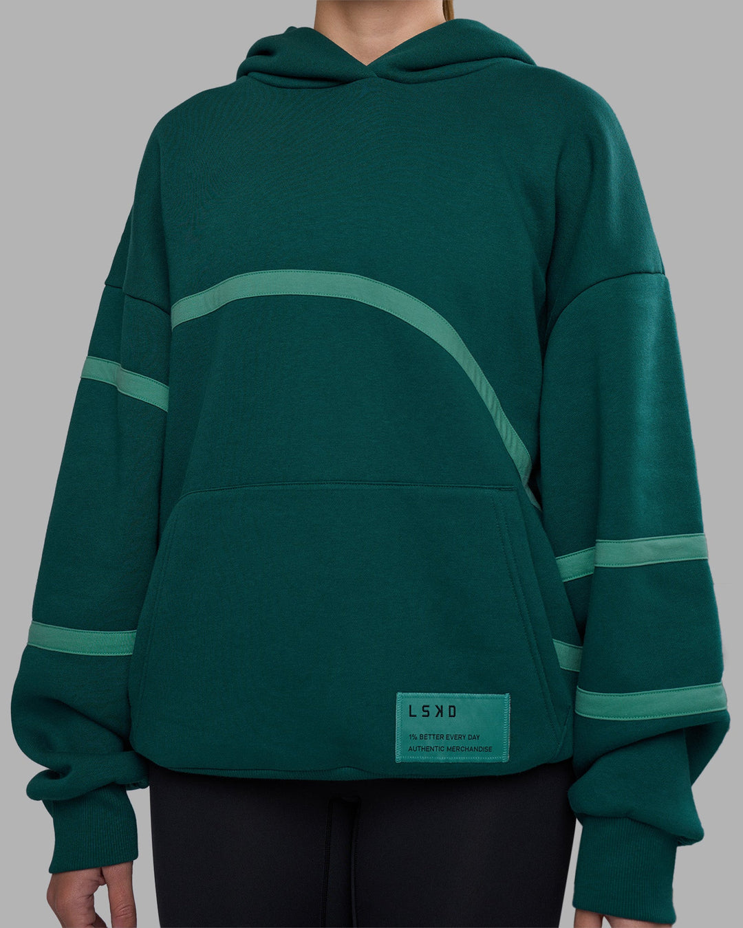 Woman wearing Movement Oversized Hoodie - Dark Moss-Agate Green | Model:Phoebe | Size:XS