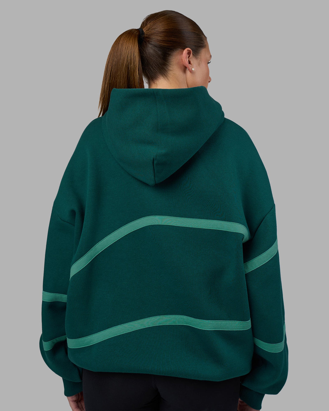 Woman wearing Movement Oversized Hoodie - Dark Moss-Agate Green | Model:Phoebe | Size:XS