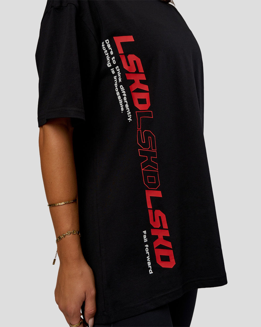Woman wearing Nothing Is Impossible FLXCotton Oversized Tee - Black-Flame | Model:Bianca | Size:XS