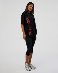 Woman wearing Nothing Is Impossible FLXCotton Oversized Tee - Black-Flame | Model:Bianca | Size:XS