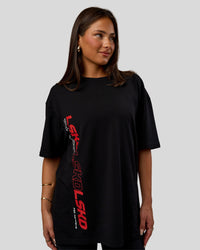 Woman wearing Nothing Is Impossible FLXCotton Oversized Tee - Black-Flame | Model:Bianca | Size:XS