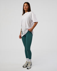 Woman wearing Nothing Is Impossible FLXCotton Oversized Tee - White-Vital Green | Model:Bianca | Size:XS