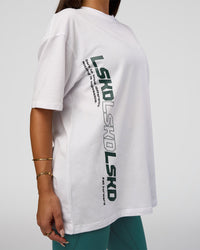 Woman wearing Nothing Is Impossible FLXCotton Oversized Tee - White-Vital Green | Model:Bianca | Size:XS