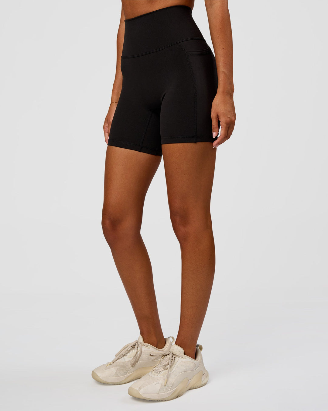 Woman wearing O.G Fusion Ultra High-Rise 6" Short Pockets - Black | Model:Charlli | Size:XS