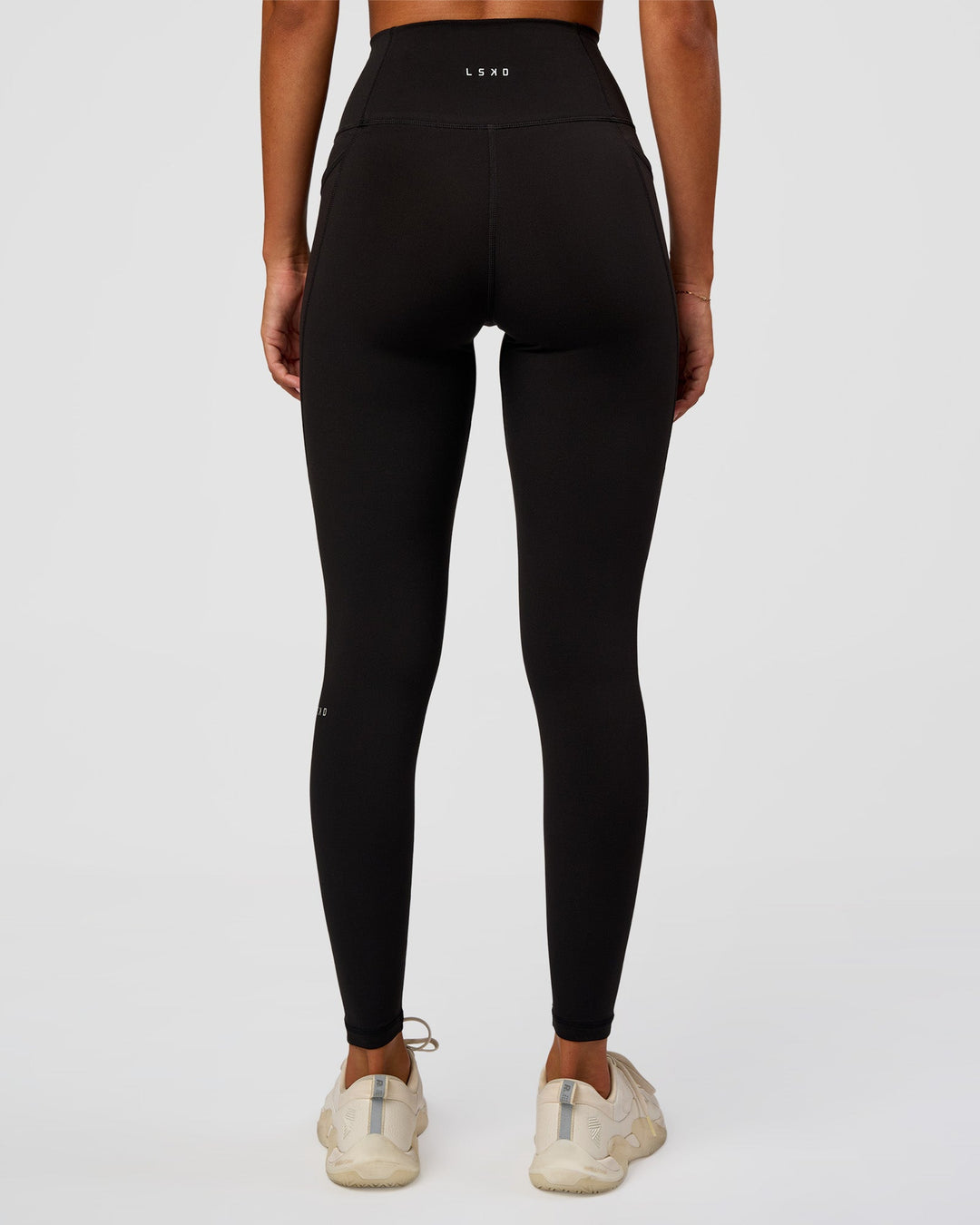 Woman wearing O.G Fusion Ultra High-Rise Full Length Legging Pockets - Black | Model:Charli | Size:XS