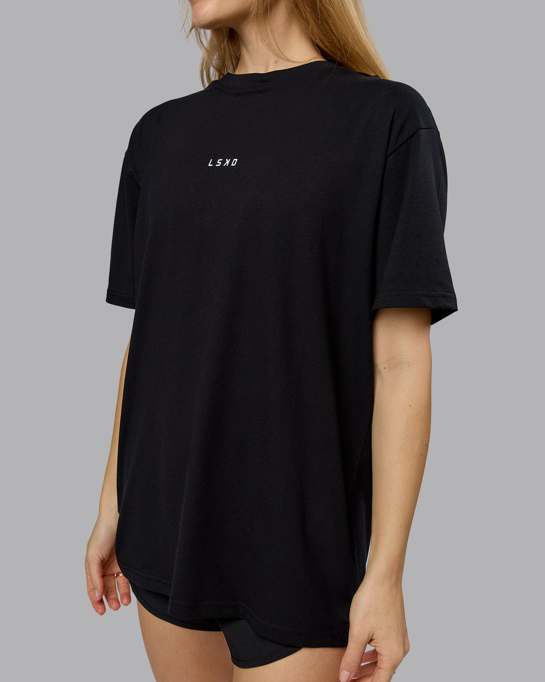 Woman wearing On Repeat FLXCotton Oversized Tee - Black-White | Model:Emilie | Size:XS
