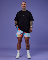 Man wearing Our Journey Heavyweight Oversized Tee - Black-Rainbow | Model:Tayden | Size:XS