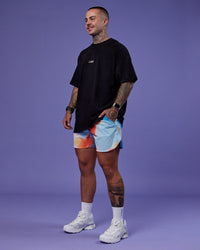 Man wearing Our Journey Heavyweight Oversized Tee - Black-Rainbow | Model:Tayden | Size:XS