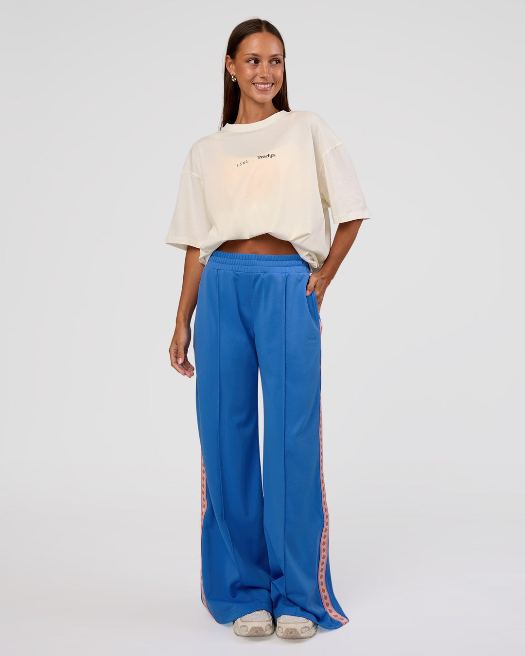 Woman wearing Peaches Track Pant - Palace Blue | Model:Brylee | Size:XS - view 9