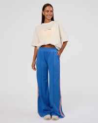 Woman wearing Peaches Track Pant - Palace Blue | Model:Brylee | Size:XS | Thumbnail Index: 8
