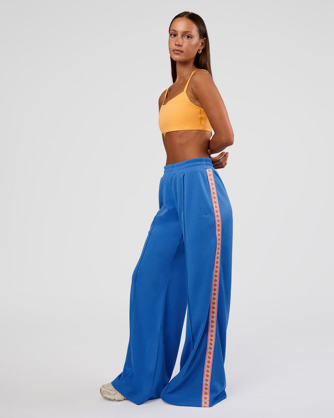 Woman wearing Peaches Track Pant - Palace Blue | Model:Brylee | Size:XS - view 7