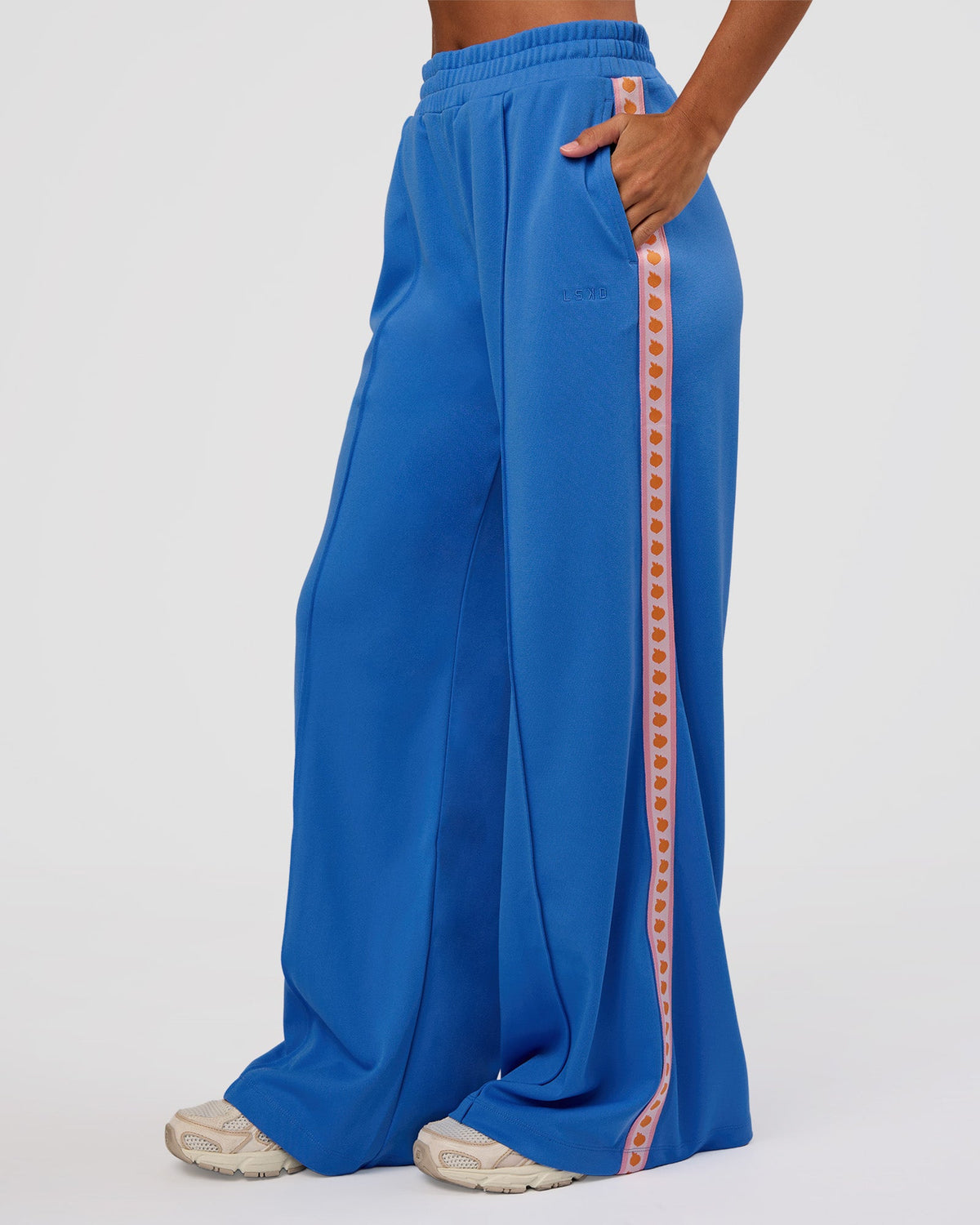 Woman wearing Peaches Track Pant - Palace Blue | Model:Brylee | Size:XS - view 1