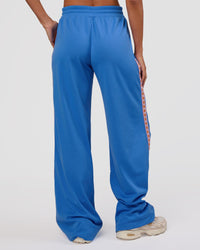 Woman wearing Peaches Track Pant - Palace Blue | Model:Brylee | Size:XS | Thumbnail Index: 5