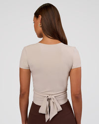 Woman wearing Peaches Wrap Cinch Top - Shale Beige | Model:Brylee | Size:XS | Thumbnail Index: 7