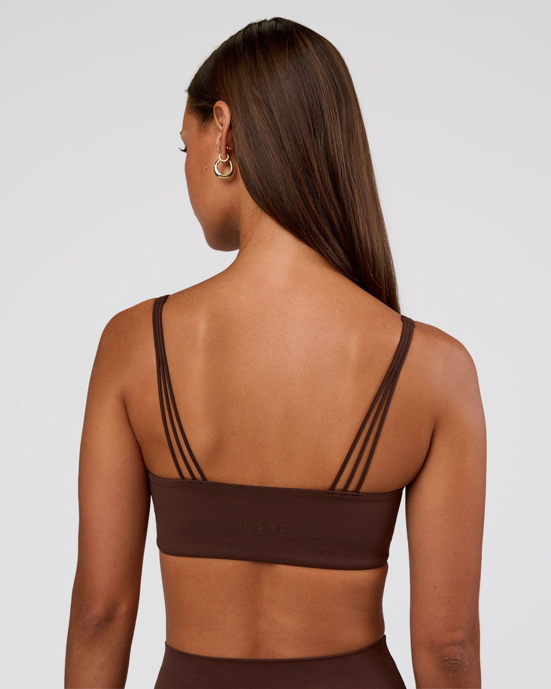 Woman wearing Peaches Wrap Sports Bra - Hot Chocolate | Model:Brylee | Size:XS - view 3