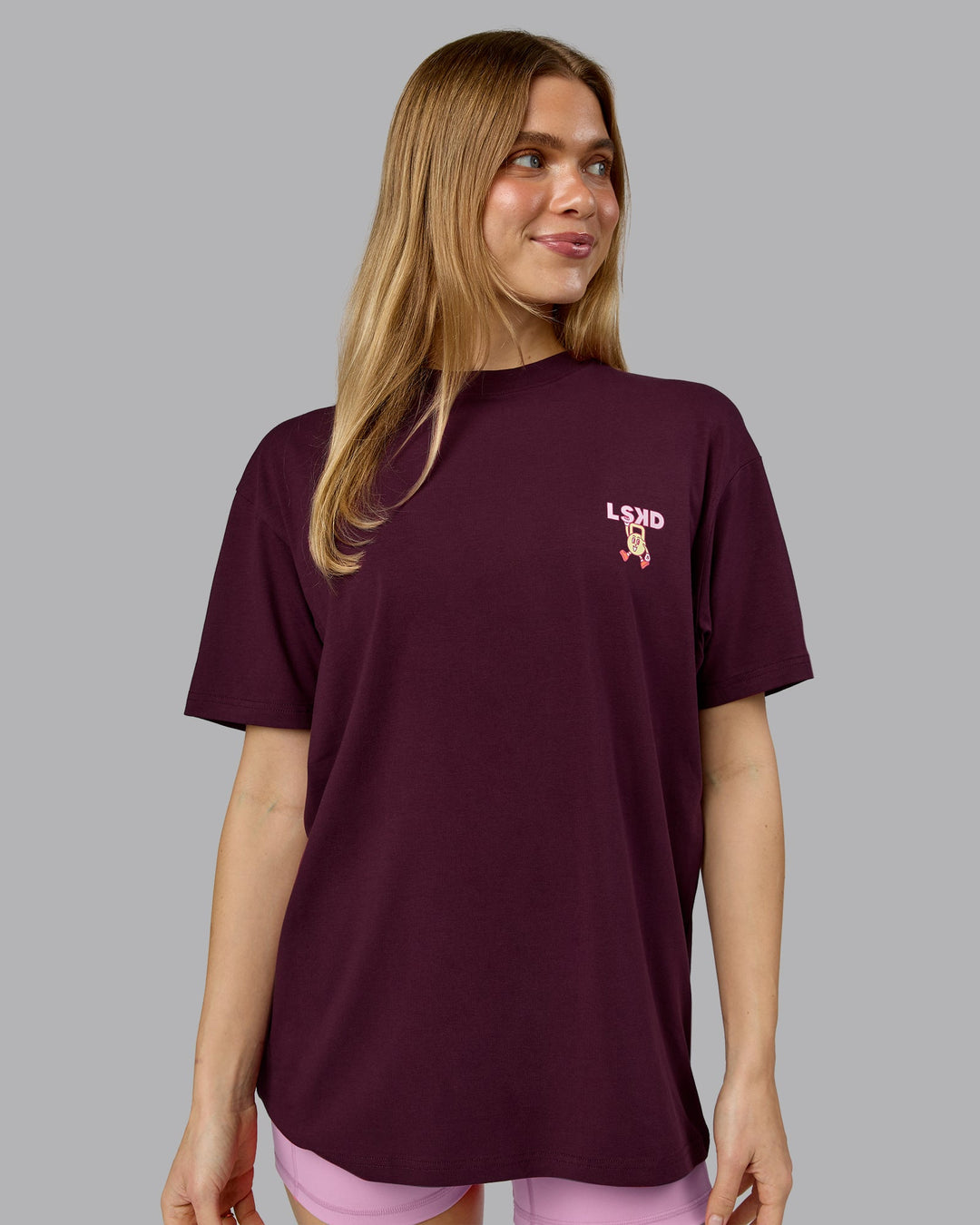 Woman wearing Perspective FLXCotton Oversized Tee - Cherry Lacquer-Soft Pink | Model:Emilie | Size:XS