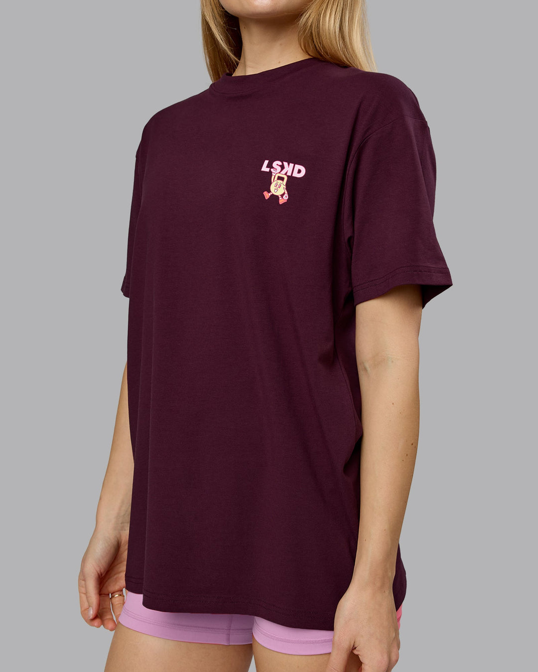 Woman wearing Perspective FLXCotton Oversized Tee - Cherry Lacquer-Soft Pink | Model:Emilie | Size:XS
