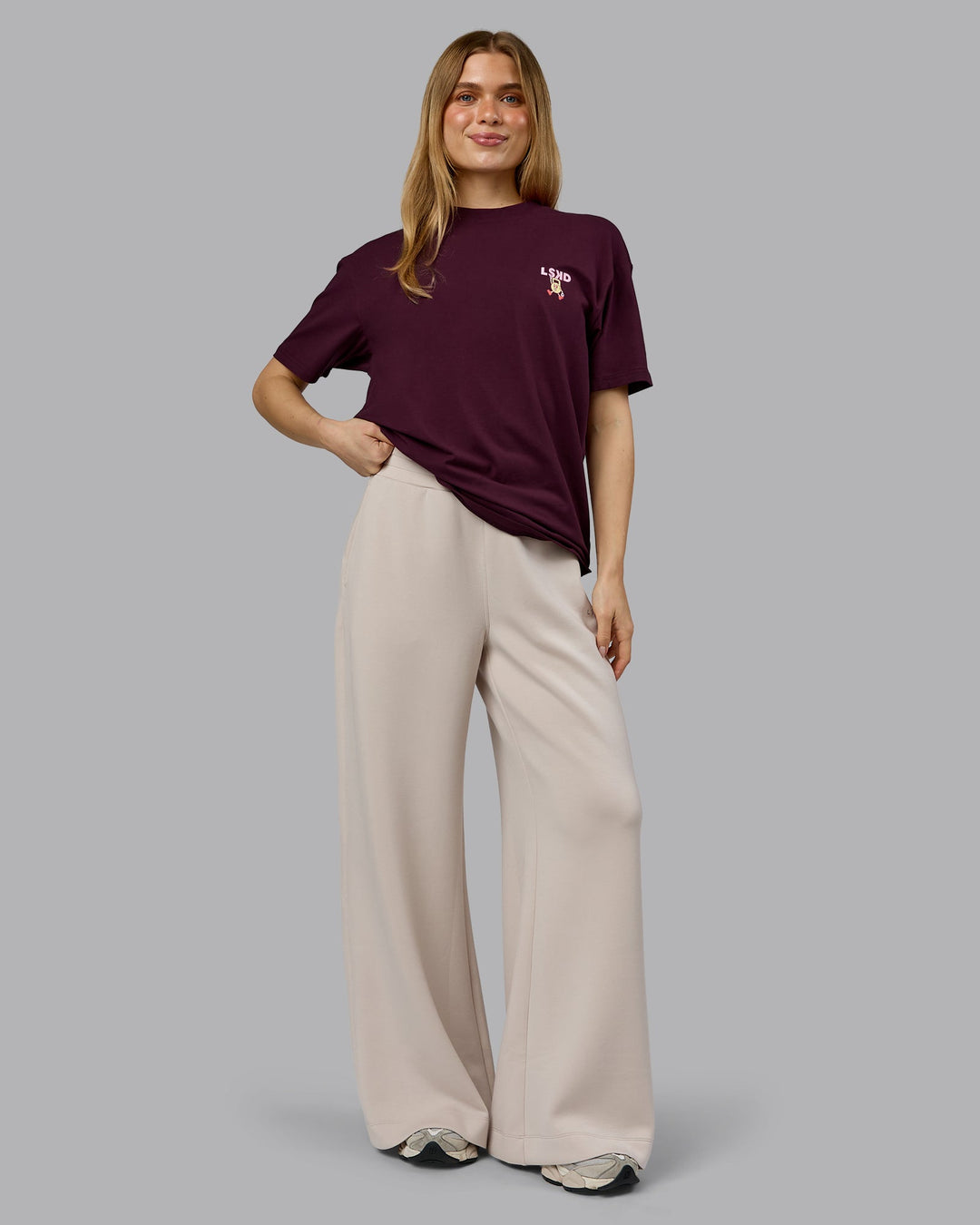 Woman wearing Perspective FLXCotton Oversized Tee - Cherry Lacquer-Soft Pink | Model:Emilie | Size:XS