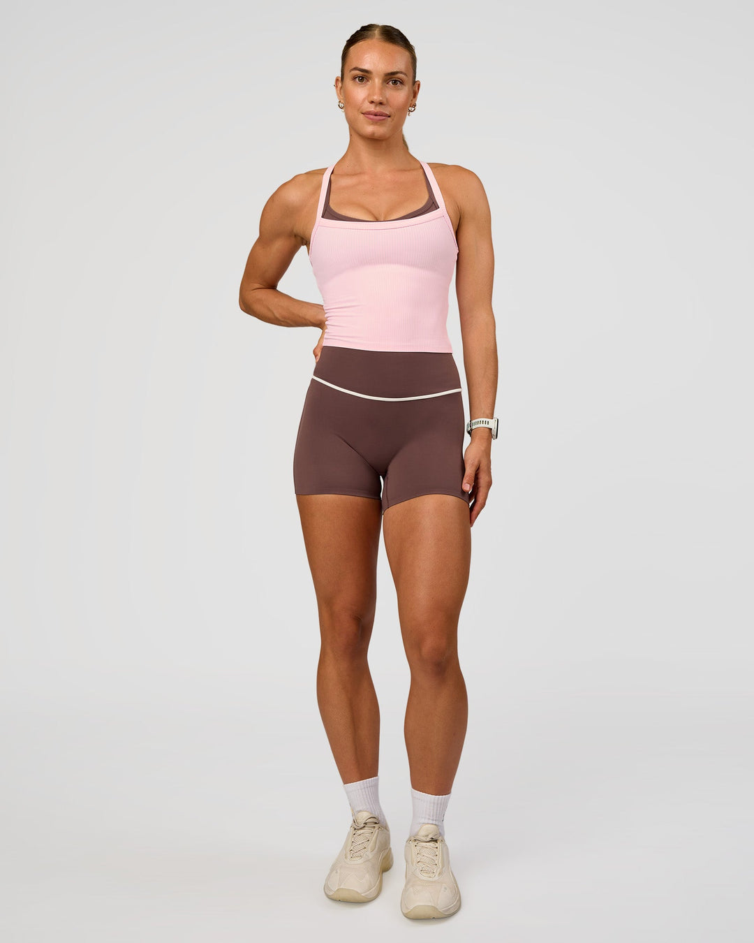 Woman wearing Pinnacle High-Rise 4" Short - Cocoa Powder-Off White | Model:Maja | Size:XS