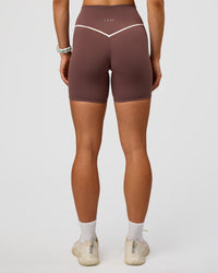 Woman wearing Pinnacle High-Rise 6" Short - Cocoa Powder-Off White | Model:Maja | Size:XS