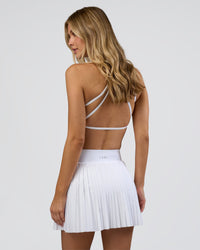 Woman wearing Precision Active Skirt - White | Model:Leilani | Size:XS | Thumbnail Index: 8