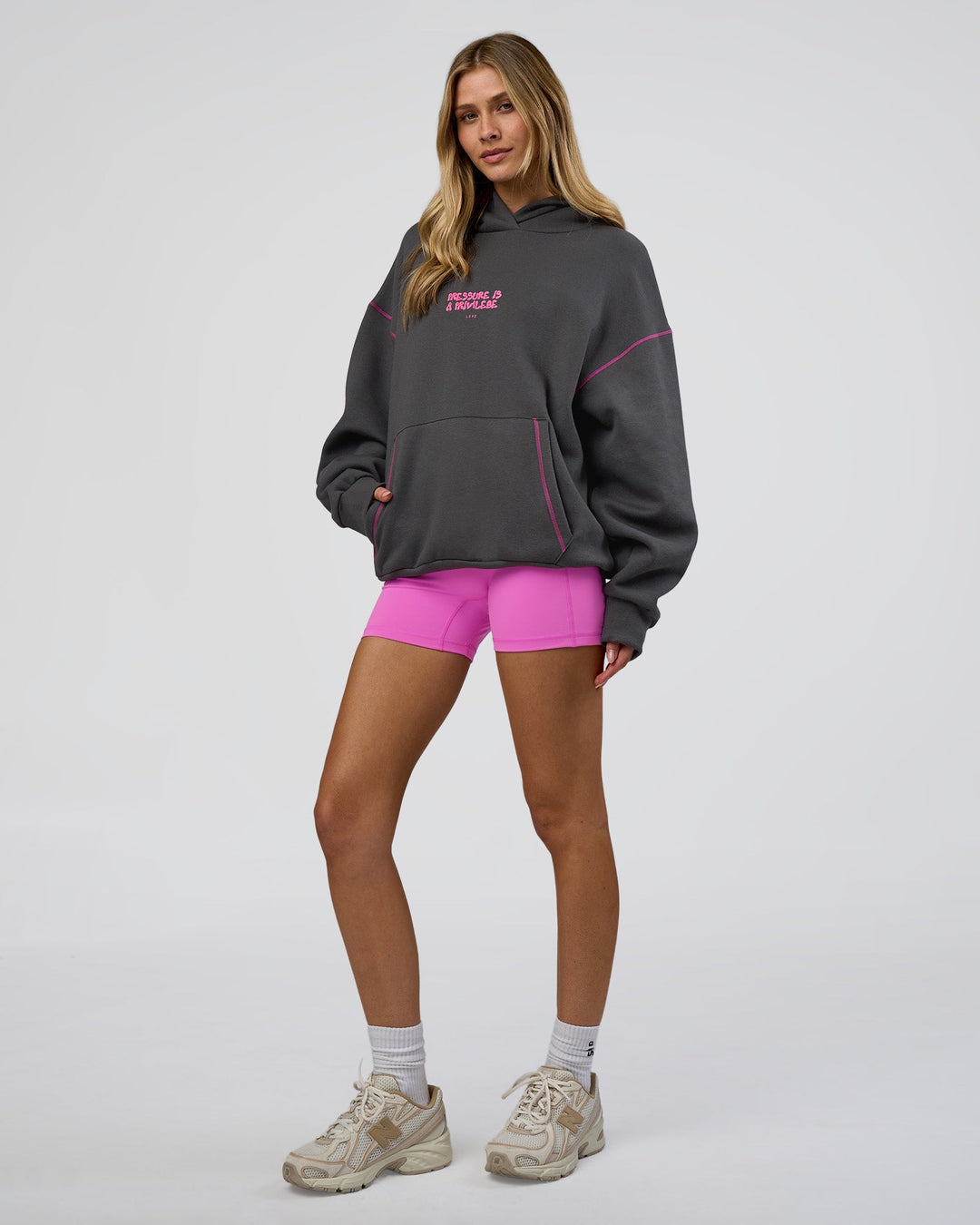 Woman wearing Pressure is Privilege Oversized Hoodie - Dark Storm-Ultra Fuchsia | Model:Leilani | Size:XS