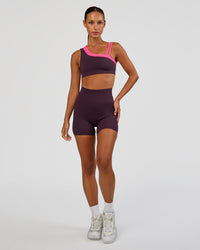 Woman wearing Progression Ultra High-Rise 4" Short - Midnight Plum | Model:Brylee | Size:XS
