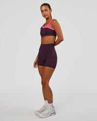 Woman wearing Progression Ultra High-Rise 4" Short - Midnight Plum | Model:Brylee | Size:XS