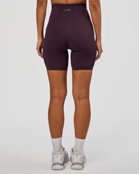 Woman wearing Progression Ultra High-Rise 6" Short - Midnight Plum | Mode:Brylee | Size:XS