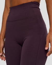 Woman wearing Progression Ultra High-Rise Full Length Legging - Midnight Plum | Model:Brylee | Size:XS