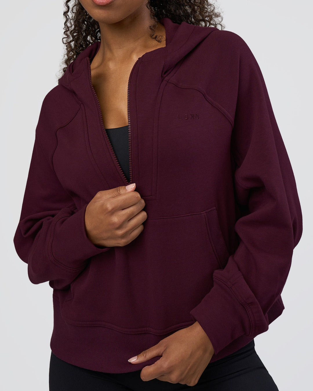 Woman wearing Pursue Mid-Weight Hoodie - Cherry Lacquer | Model:Jordan | Size:XS
