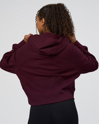 Woman wearing Pursue Mid-Weight Hoodie - Cherry Lacquer | Model:Jordan | Size:XS