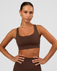 Woman wearing Race Day Sports Bra - Hot Chocolate | Model:Brylee | Size:XS
