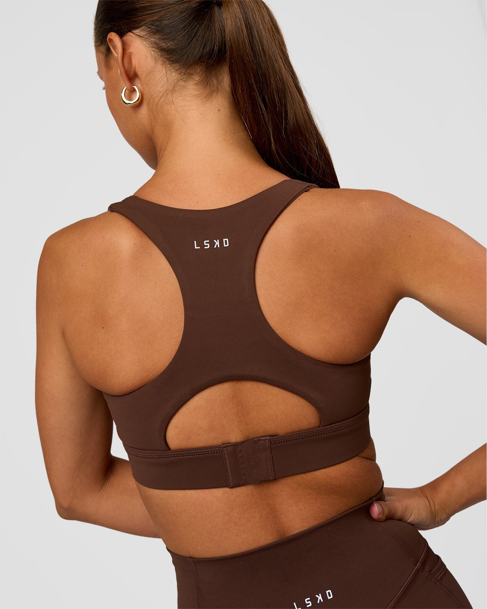 Woman wearing Race Day Sports Bra - Hot Chocolate | Model:Brylee | Size:XS