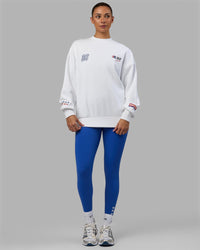 Woman wearing Unisex Redline Sweater Oversize - White-Navy
