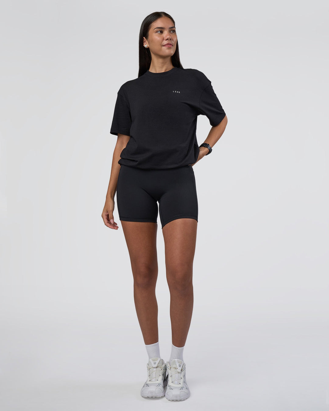 Woman wearing Research Department FLXCotton Oversized Tee - Black | Model:Rhiley | Size:XS