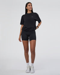 Woman wearing Research Department FLXCotton Oversized Tee - Black | Model:Rhiley | Size:XS