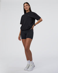 Woman wearing Research Department FLXCotton Oversized Tee - Black | Model:Rhiley | Size:XS