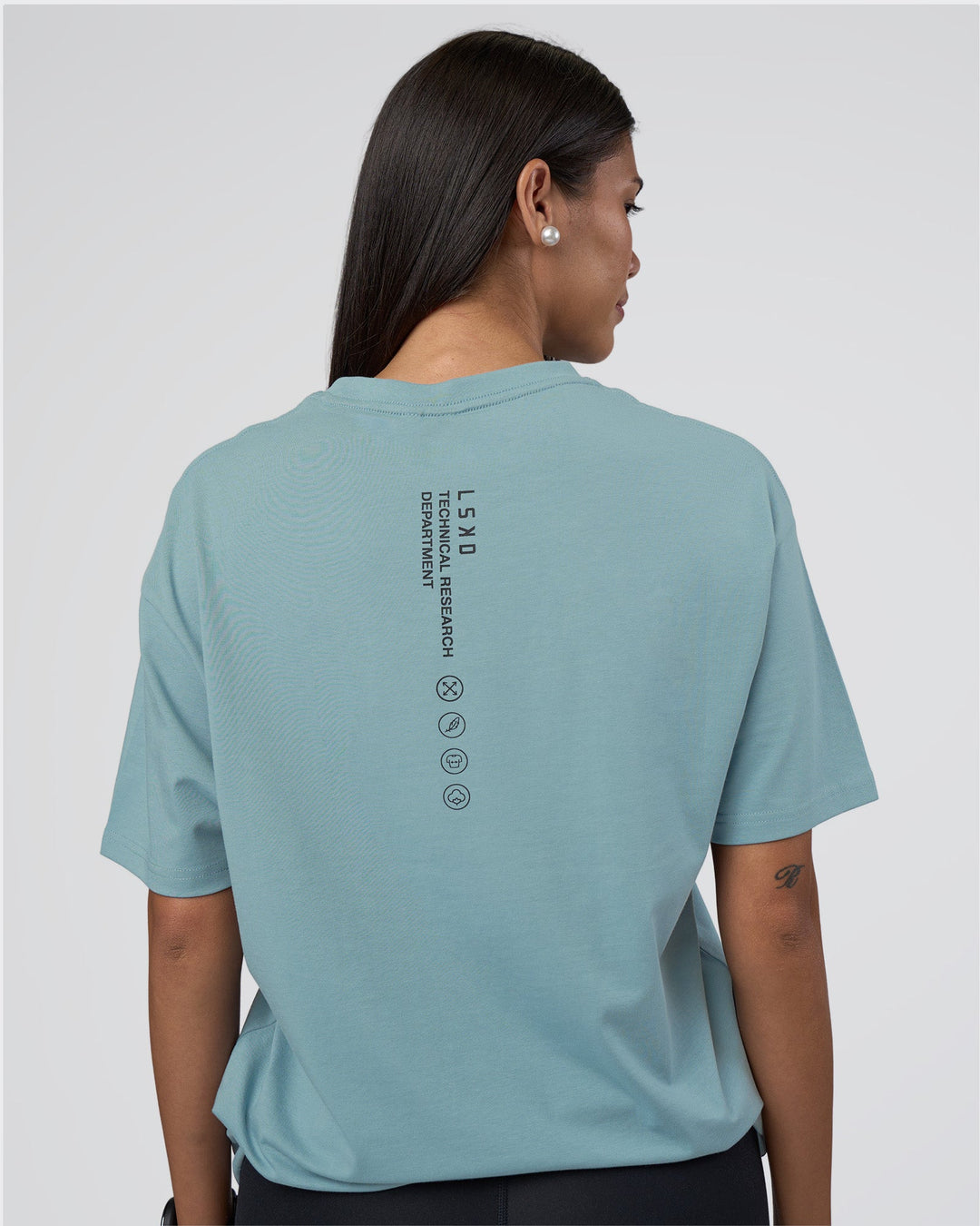 Woman wearing Research Department FLXCotton Oversized Tee - Smoke Blue | Model:Rhiley | Size:XS