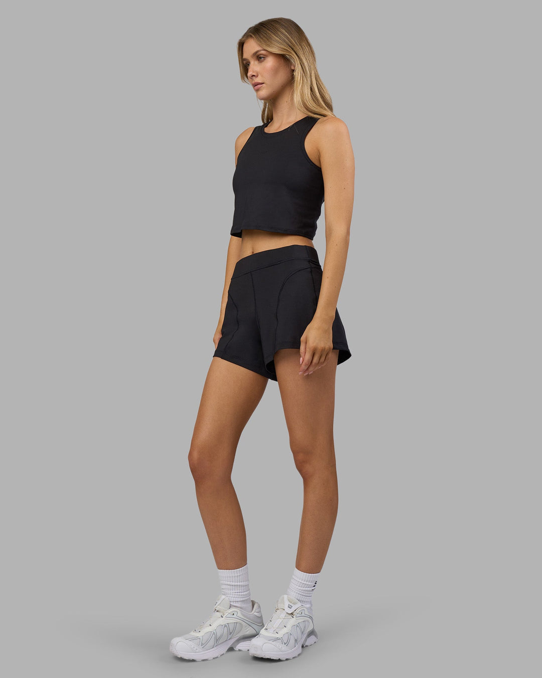 Woman wearing Restore CloudFLX Tank - Black | Model:Leilani | Size:XS