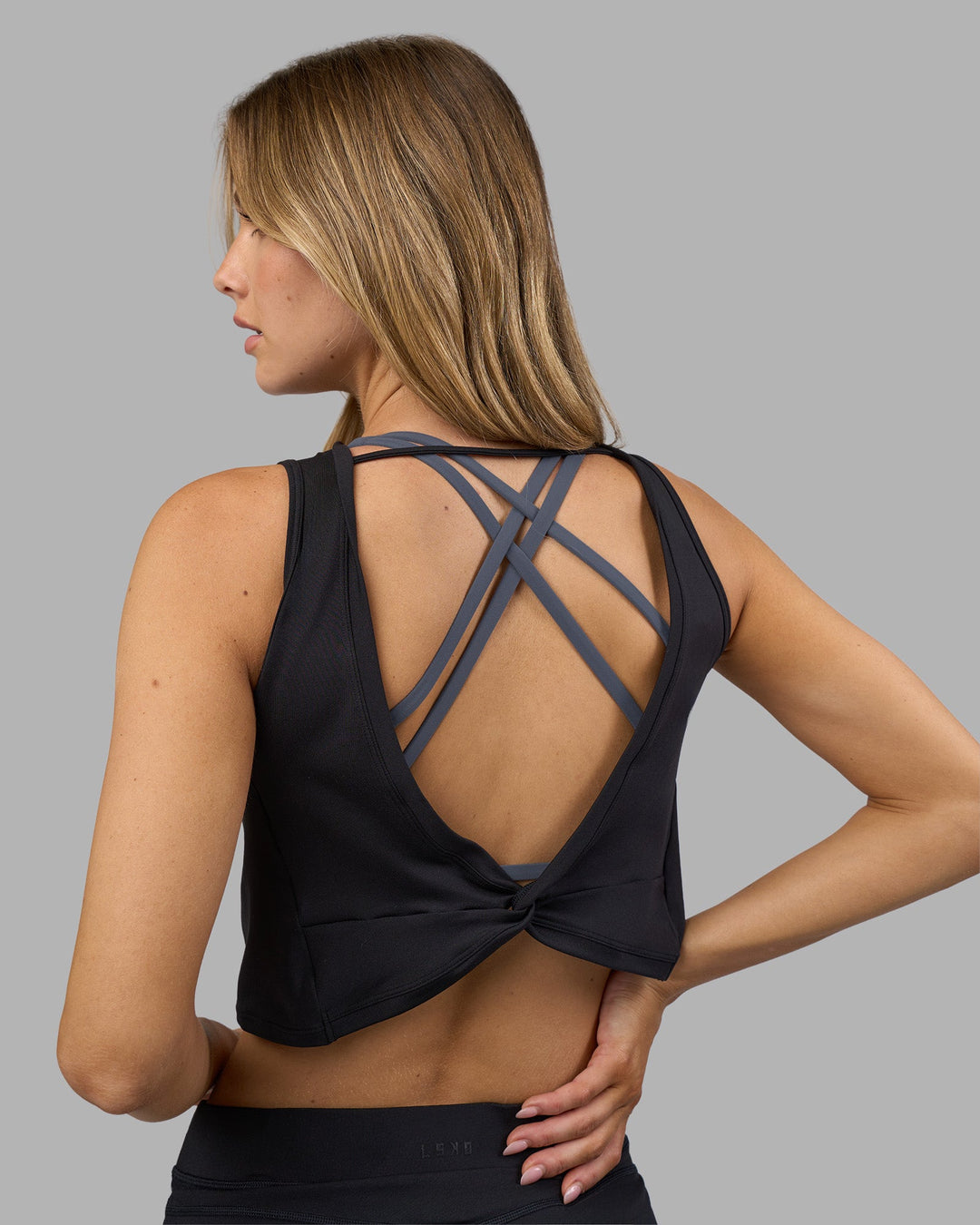 Woman wearing Restore CloudFLX Tank - Black | Model:Leilani | Size:XS