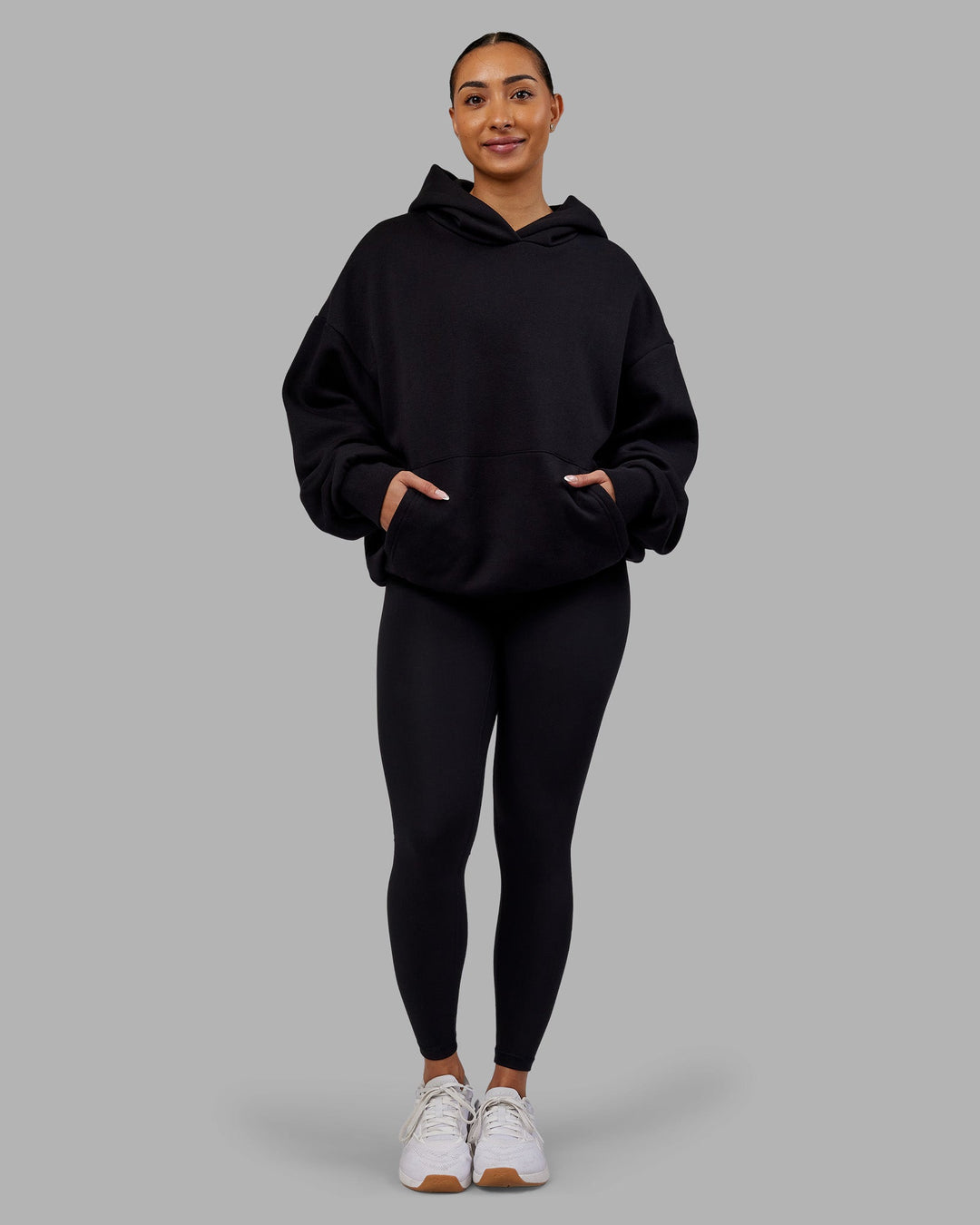 Woman wearing Rise &amp; Lift Hoodie Oversized - Black-White | Model:Ayla | Size:XS