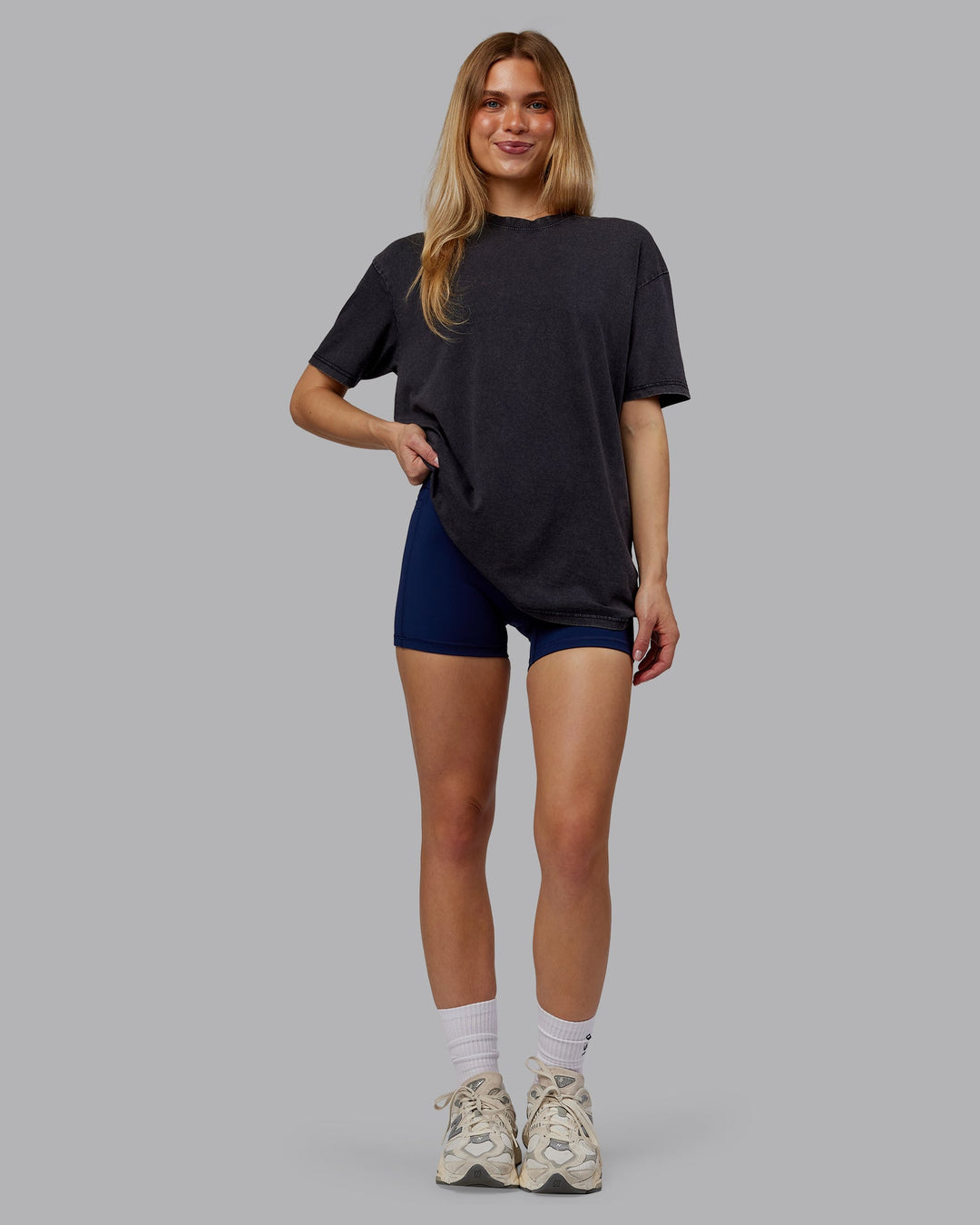 Woman wearing Rise &amp; Lift Washed FLXCotton Oversized Tee - Washed Black-Indigo | Model:Emilie | Size:XS