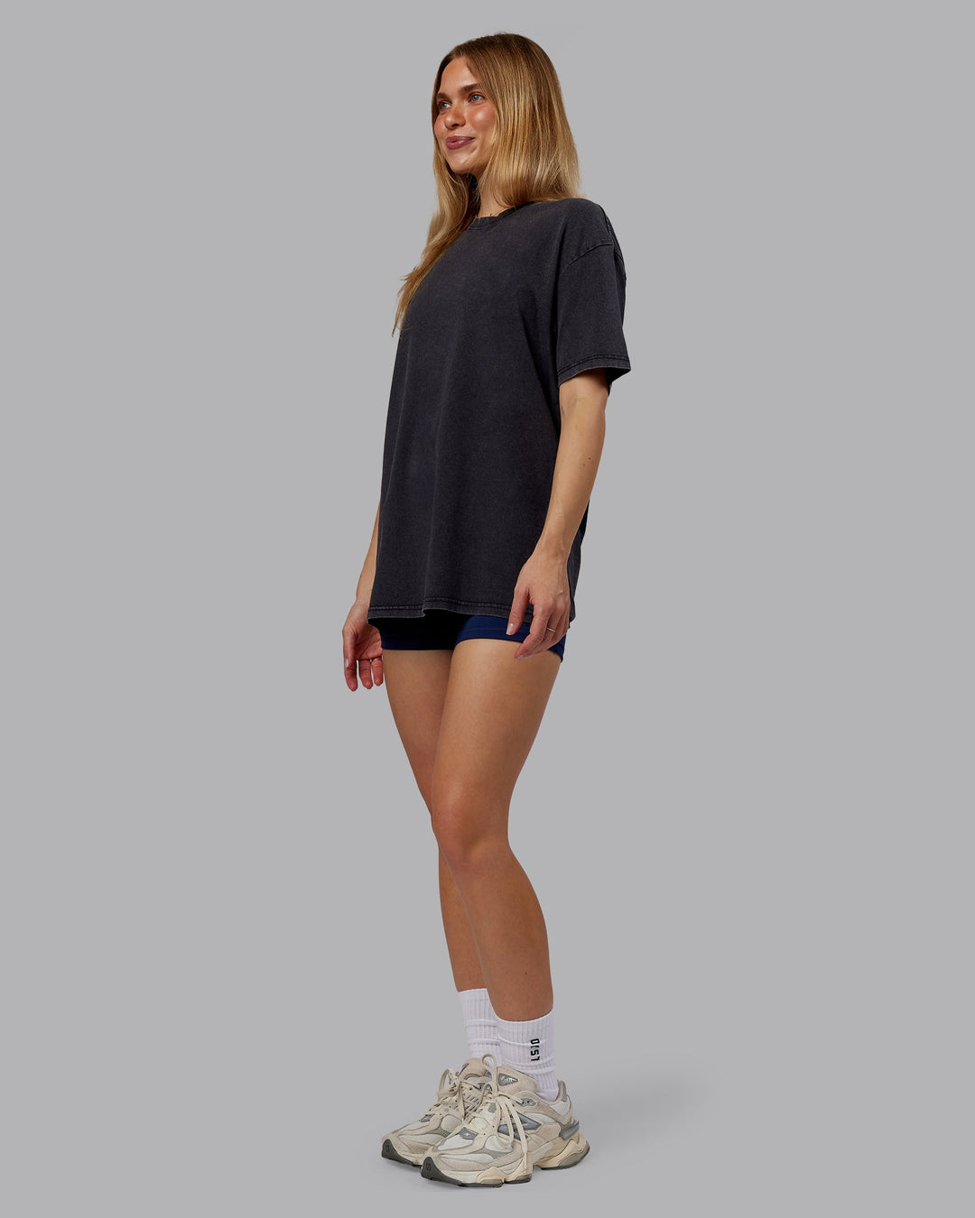 Woman wearing Rise &amp; Lift Washed FLXCotton Oversized Tee - Washed Black-Indigo | Model:Emilie | Size:XS