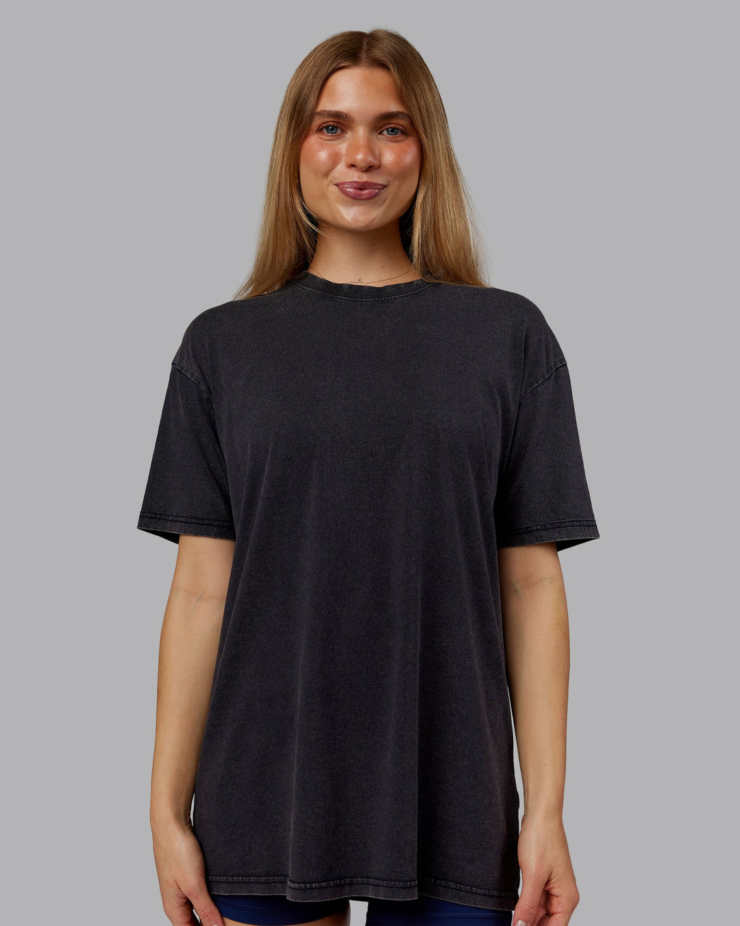 Woman wearing Rise &amp; Lift Washed FLXCotton Oversized Tee - Washed Black-Indigo | Model:Emilie | Size:XS